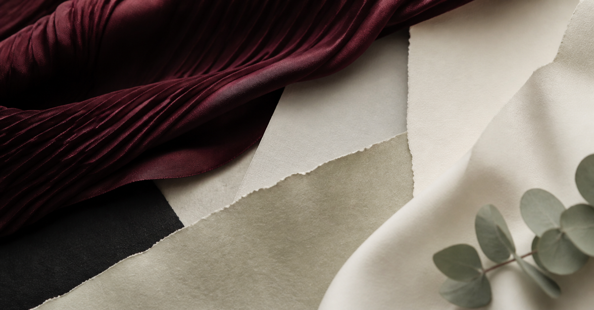 Abstract Muse & Hem brand composition in warm cream, berry and sage tones.